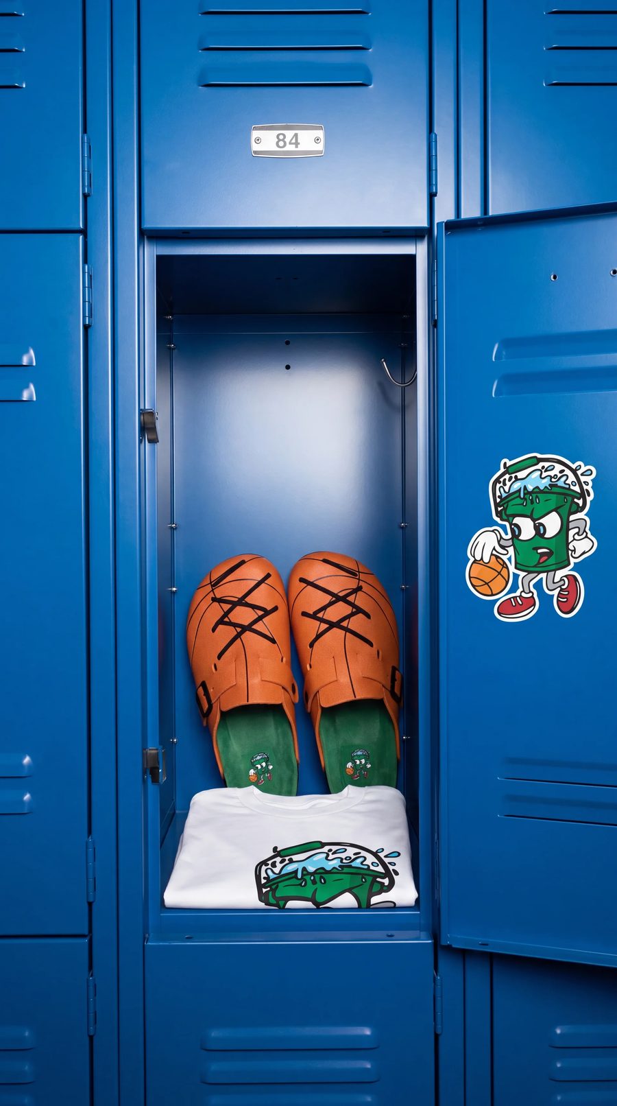 WB-001 clogs and tee in a gym locker