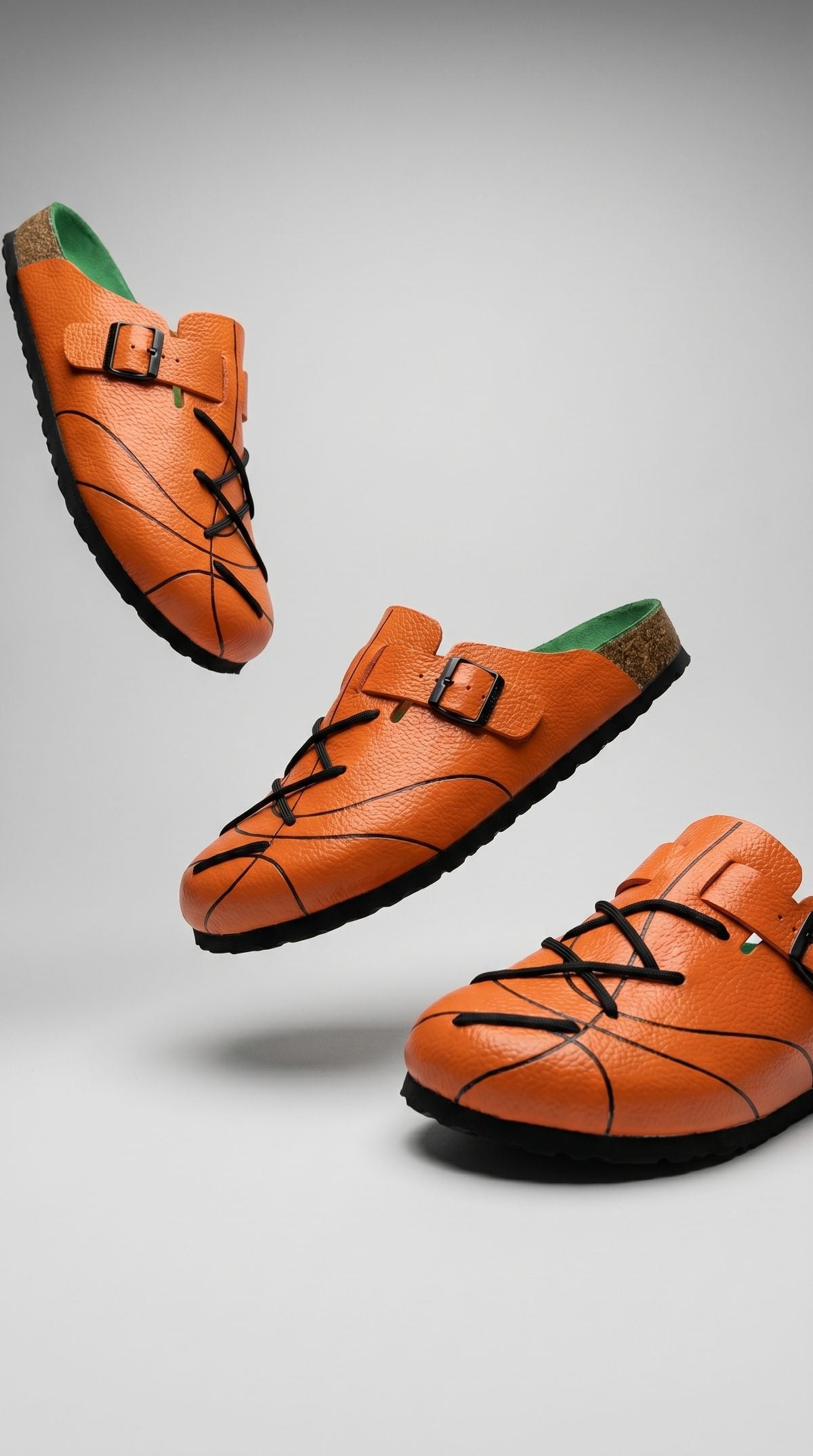 Three WB-001 clogs floating studio shot